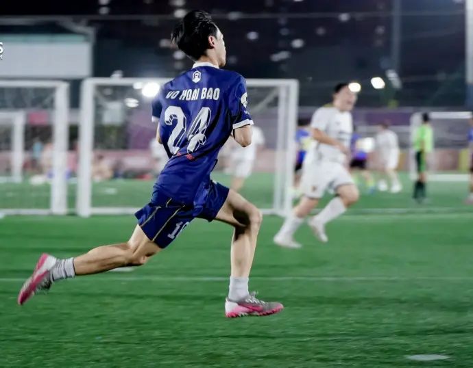 club members play football in saigon