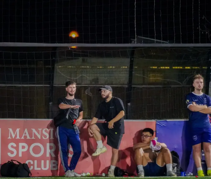 club members play football in saigon