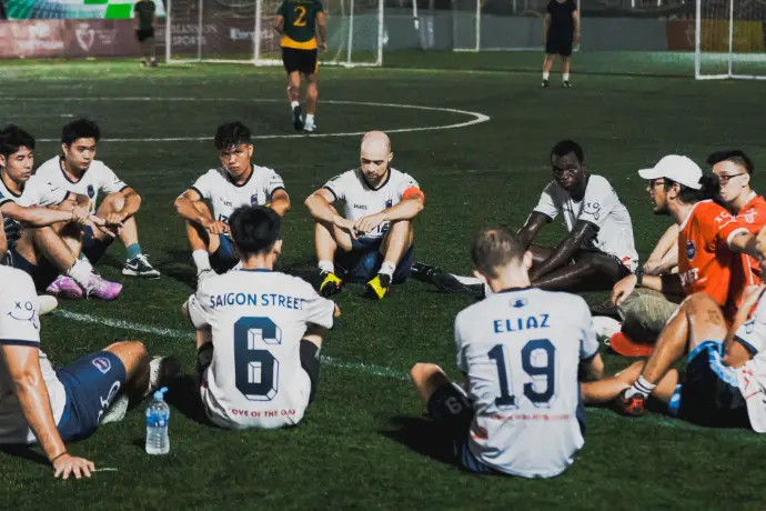 club members play football in saigon